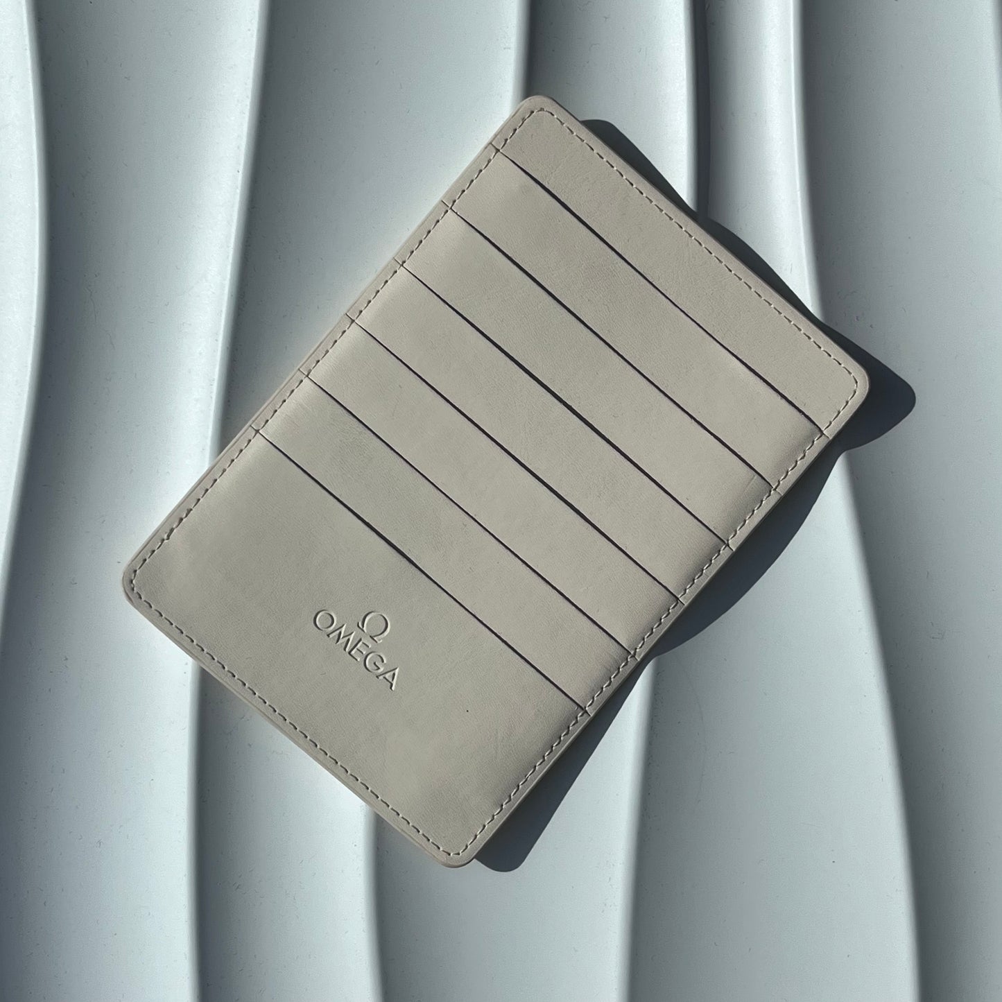 OMEGA WHITE LEATHER CARD HOLDER WITH 8 CARD SLOTS PRE-LOVED