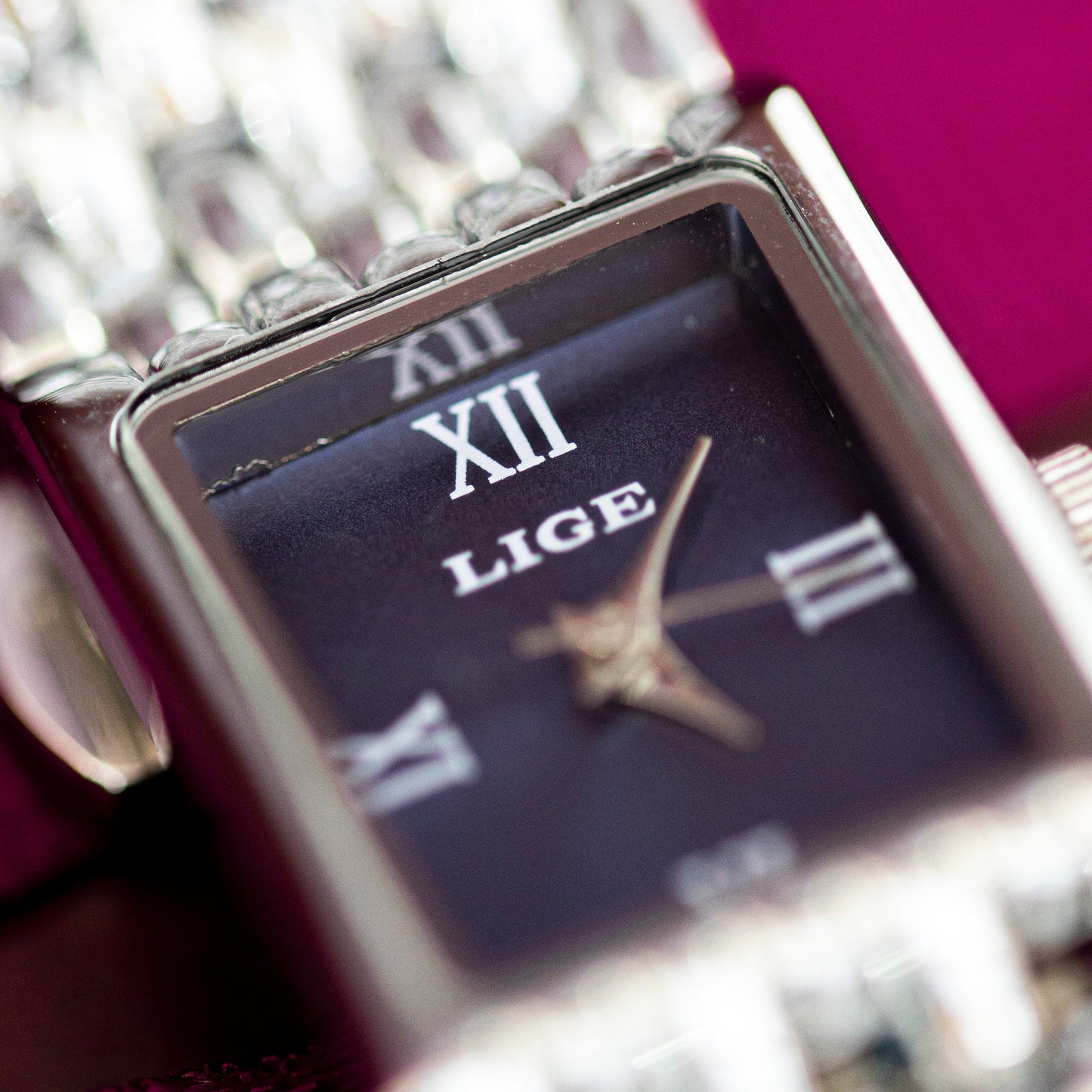 Close-up of a Lige watch with a blurred background
