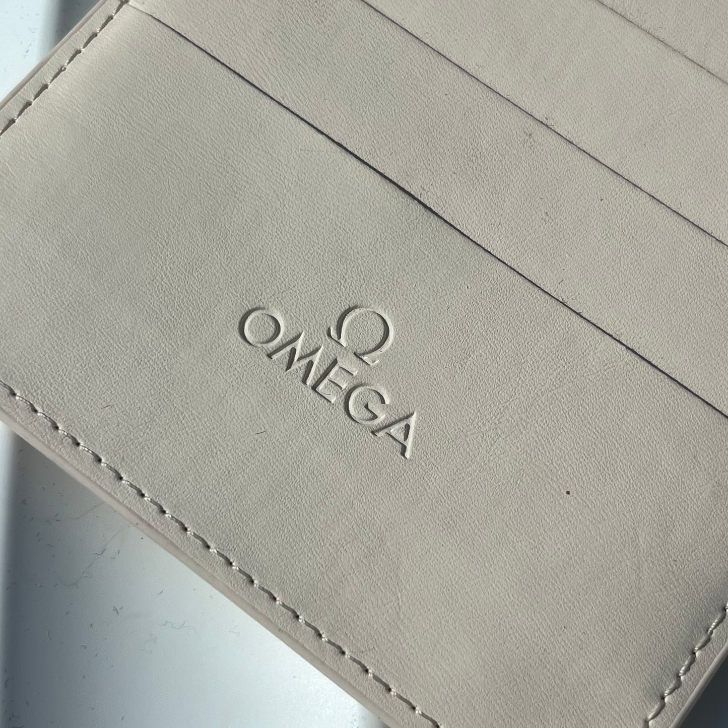 OMEGA WHITE LEATHER CARD HOLDER WITH 8 CARD SLOTS PRE-LOVED