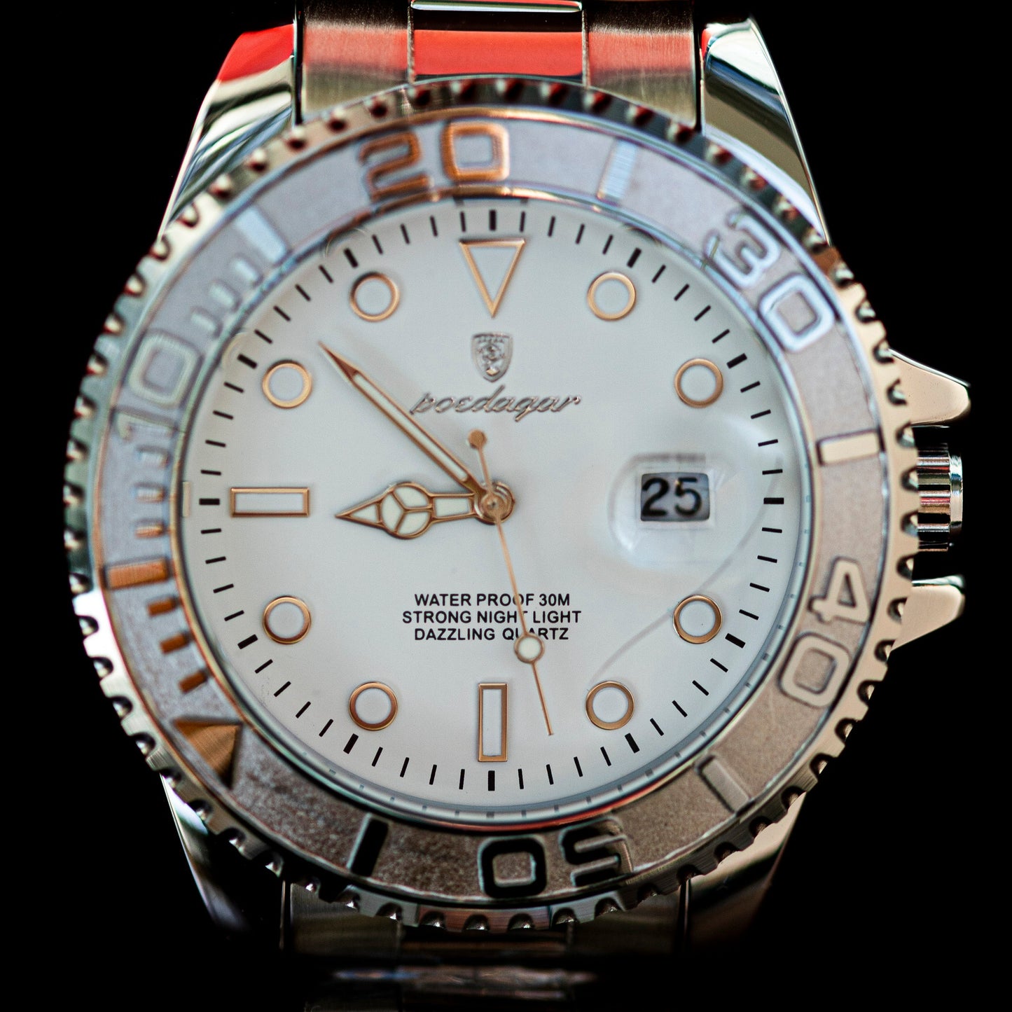 Silver watch with detailed face and brand logo on a black background