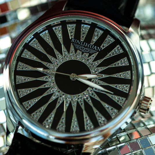 Watch with a decorative face on a reflective surface